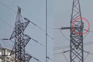 man climbs Electric Tower